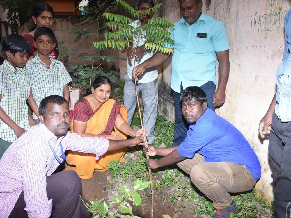 The principal of the Corporation School, Ms. Stella with students.